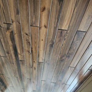 Close-up of Synergy Wood ceiling installed by CFL Custom Carpentry, featuring natural wood grain and professional craftsmanship