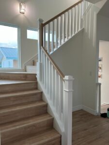 Open-concept staircase design tips highlighting a light-filled layout and CFL Custom Carpentry’s expert craftsmanship.