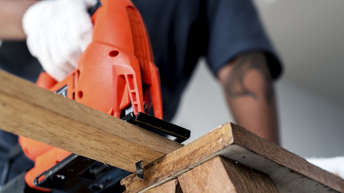 Carpenter crafting a wooden masterpiece.